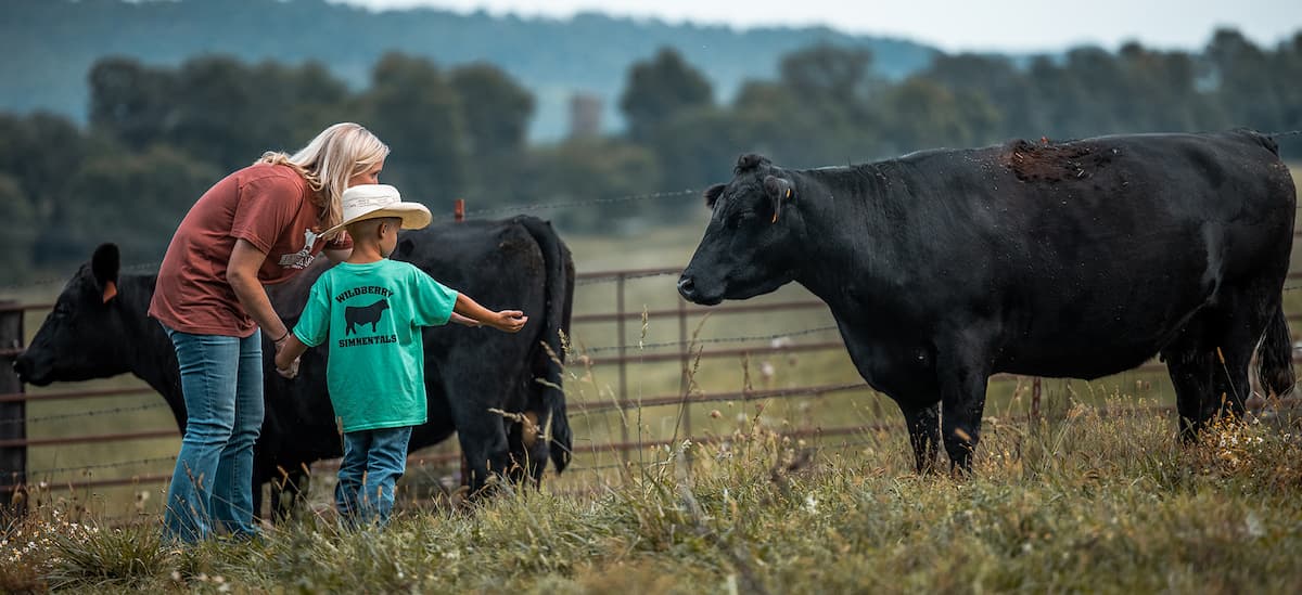 Female and child with cows - Zoetis