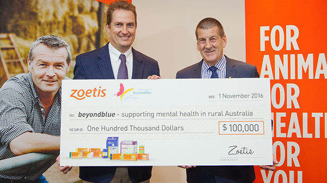Lance Williams, general manager Zoetis Australia and New Zealand, presents beyondblue chairman The Hon. Jeff Kennett AC with a $100,000 check to support mental health issues in rural Australia.