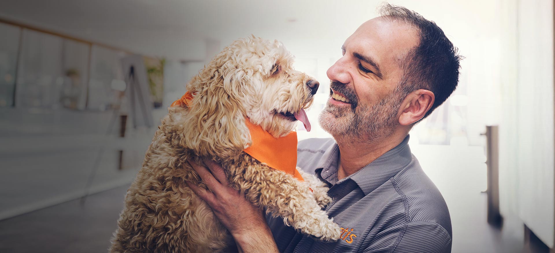 Zoetis colleague holding dog - Zoetis
