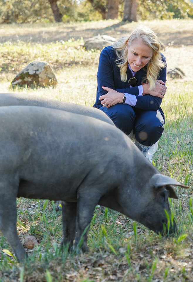 Kristen Peck holding a piglet