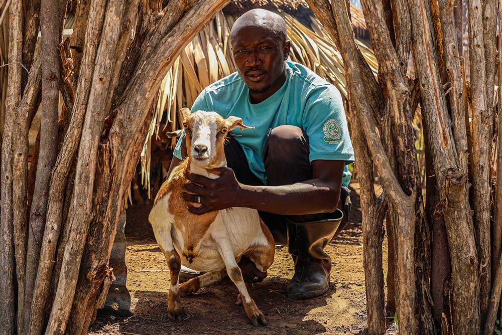VWB-supported goat farmer with goat - Zoetis