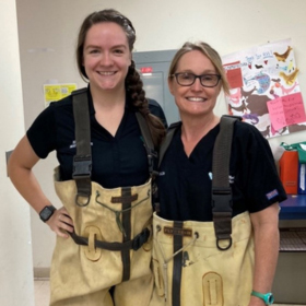 Dr. Catherine Bartholf and Dr. Michelle Davis in waders at the New York Aquarium - Zoetis